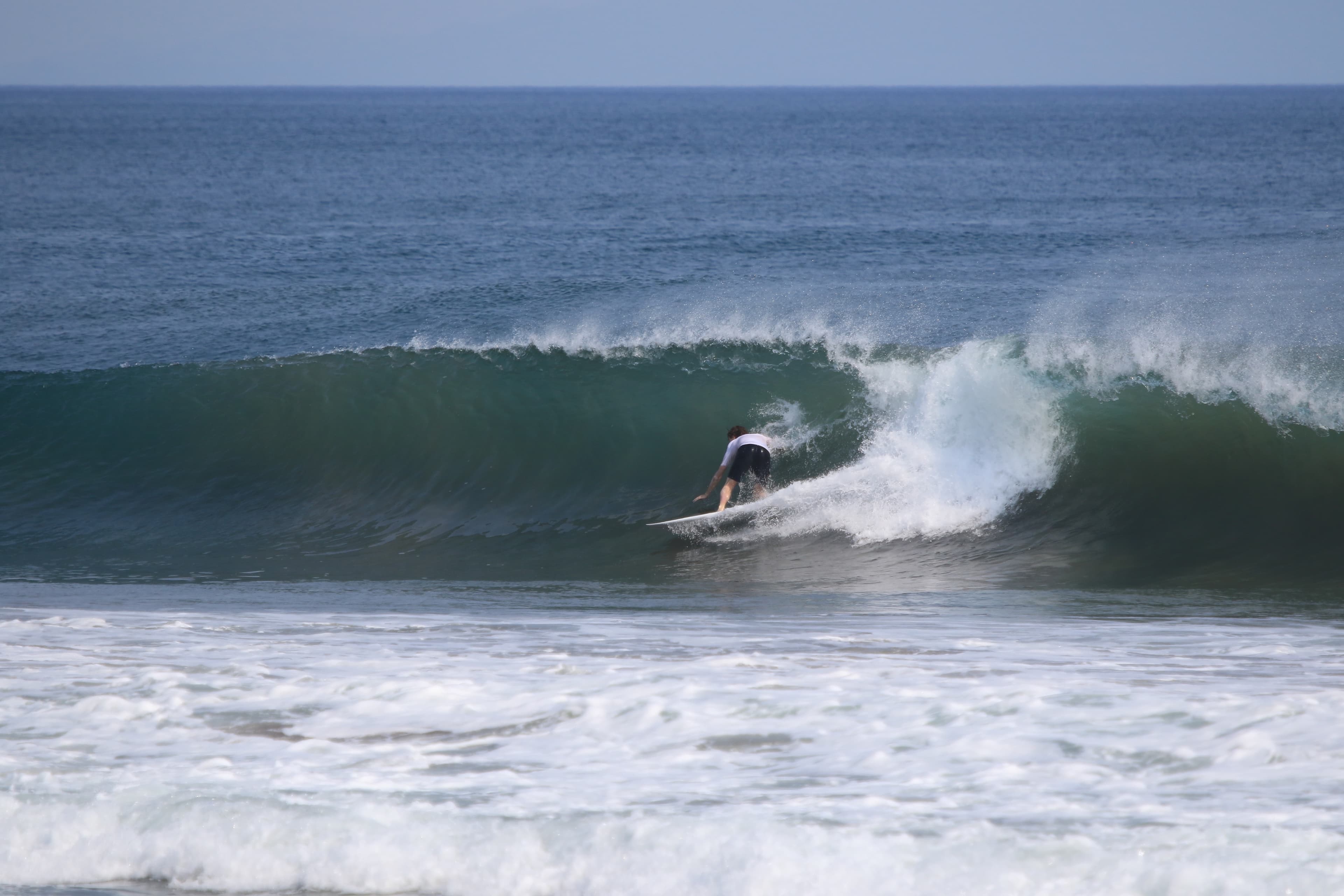 Surfing a wave in Nicaragua